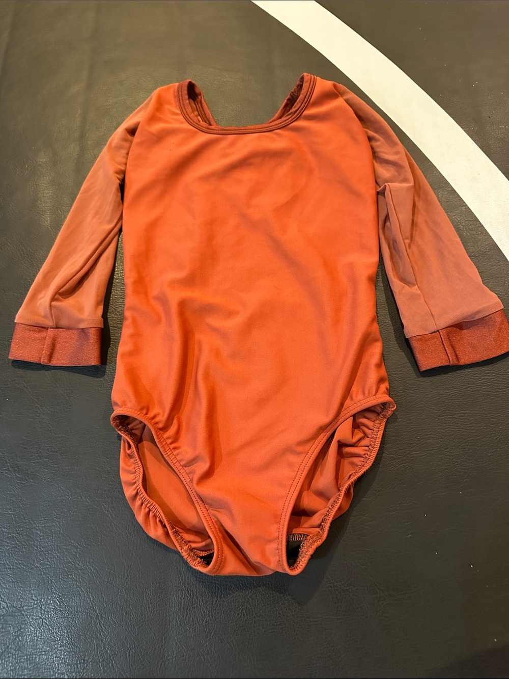 Kids Long Sleeve dance leotard in Rust Orange